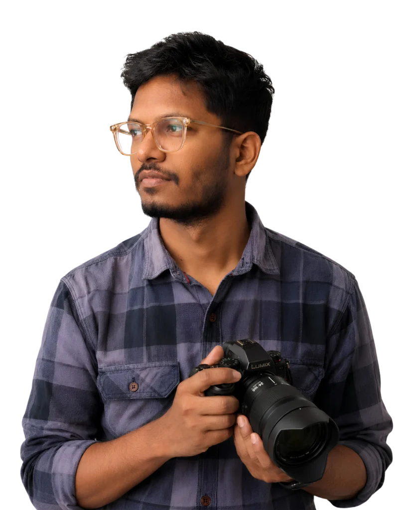 Neranjan Kumar, graphic designer and content creator in Salem, holding a professional camera for photography and visual storytelling.